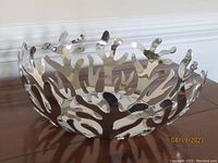 Full view of the Alessi Mediterraneo fruit bowl showing openwork coral branch design in polished stainless steel.