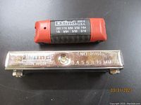 Set of Allen wrenches in red plastic case and metal numbered gauge