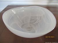 White alabaster bowl, translucent with swirling patterns inside, round shape, 5.5x5.5x2.5 inches