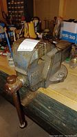 Front and side view of the vise bolted to the workbench showing overall condition