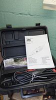 Jobmate rotary tool with power cord, accessories, and user manual in black plastic case