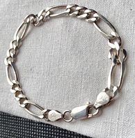 Close-up photo of the bracelet chain links and lobster clasp.