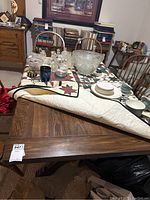 Top view of table with quilt and dishes (contents not included)