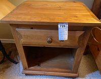 Pair of wooden side tables each with one drawer and open bottom shelf, showing condition issues like stains and scratches.