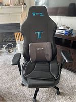 Front view of assembled Secret Lab Titan 2020 gaming chair with lumbar pillow and Phoenix seat cushion