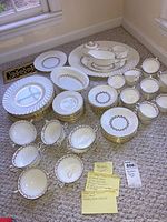 Full set laid out on carpet showing all pieces in a group arranged by type