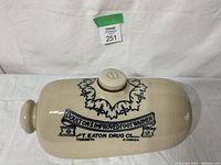 Top-down view of the Doulton's Improved Foot Warmer showing the design and text clearly.