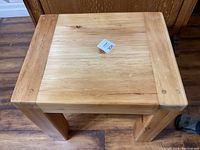 Top view of pine end table showing rectangular tabletop with visible wood grain and edge details.