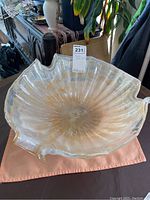 Top angle view of the large Murano glass bowl showing the wavy, ruffled edges and swirl pattern inside the bowl.