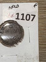 Front side of the 1938 Newfoundland penny showing the date and denomination with the central motif.