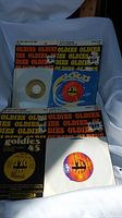 Four vintage Goldies 45 vinyl records including two partially inside sleeves and two with original packaging