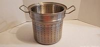 Large metal perforated strainer pot with handles