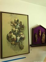 Framed signed painting showing several figures from above, muted colors, signed bottom right