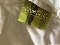 Close-up photo of label on white bamboo rayon sheet showing 350 thread count