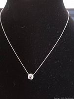 Front view of 18-inch sterling silver necklace with small Mystic Topaz pendant.