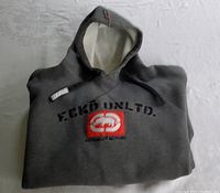 Folded front view of dark gray Ecko Unlimited hoodie showing embroidered logo on chest.