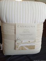 Packaged Casaluna branded king size comforter set featuring linen blend fabric with visible striped pattern.
