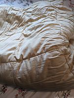 Close-up of champagne beige king size duvet, showing texture and thickness