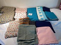 Overview showing multiple folded fabric pieces including patterned and solid color fabrics with a label indicating 72"