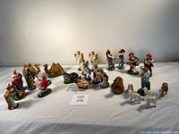 Full set of nativity figurines laid out showing all pieces
