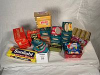 Overall lot image showing multiple vintage bar soap packages of various brands and types.