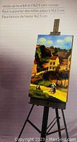 Photo of easel holding a painted canvas showing canvas height capacity up to 64 inches (162.5 cm)