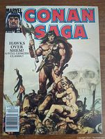 Front cover of Marvel Conan Saga comic number 49 showing Conan the Barbarian holding an axe with a woman and skull background.
