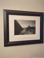 Framed photo of the Pyramids at Giza showing the full frame and wall placement.