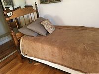 Full side view of assembled bed frame with mattress in place