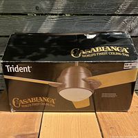 Box showing Casablanca Trident 45" ceiling fan with brushed nickel finish and wood blades.