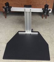 Top view of the Kangaroo Ergo Desktop Elite showing dual monitor VESA mounts and black desktop surface