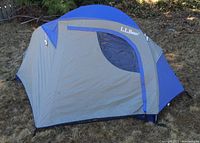 Side view showing blue and gray nylon fabric with a logo and clear window.