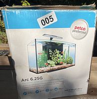 Photo of the front box showing Petco branding, Arc 6.25G fish tank with sample setup image.