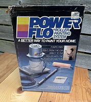 Box of Power Flo roller painting system showing front with photo of unit and main selling points
