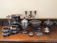 Photo of entire silver plate lot with all items grouped together showing overall condition and variety