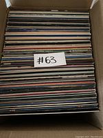 Top down photo showing the box full of vinyl records packed vertically.