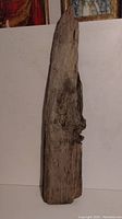 Front view of the large hardwood driftwood piece showing natural texture, knots and irregular shape.