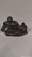 Front view showing mother and child figures
