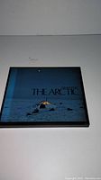 Front of original slipcase showing title “The Arctic” and Arctic tent illustration