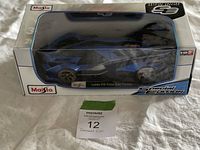 Lamborghini Vision Gran Turismo blue metallic model in original Maisto box with clear display window.