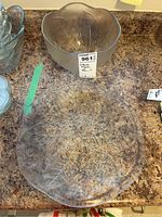 Overhead photo of the glass serving bowl and matching glass plate showing leaf pattern and size.