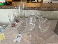 Overview of all glassware included: six short-stem wine glasses, two tall champagne flutes, and two tumblers.