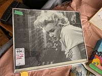 Front view of black and white Marilyn Monroe framed photo showing overall condition and framing.