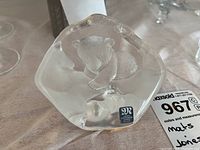 Top view showing the bear cub inside the clear irregular shaped lead crystal base with a Mats Jonasson sticker.