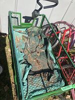 Top view of wagon loaded with fabric liner, pine cones, dirt