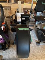 Overall view of Xterra rowing machine showing flywheel housing and seat rail