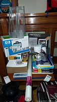 Overview of lot with printer boxes, office supplies, and packaging