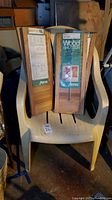Wood shutters and plastic chair in basement storage.