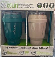 Box front showing two 40oz vacuum insulated mugs, one teal green and one beige, in original packaging.