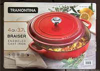 Photo of boxed Tramontina 4 quart enameled cast iron braiser in red, showing branding, product name, key features, and packaging.